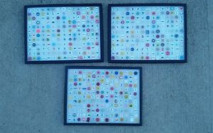 540 assorted various golf ball markers in shadow boxes